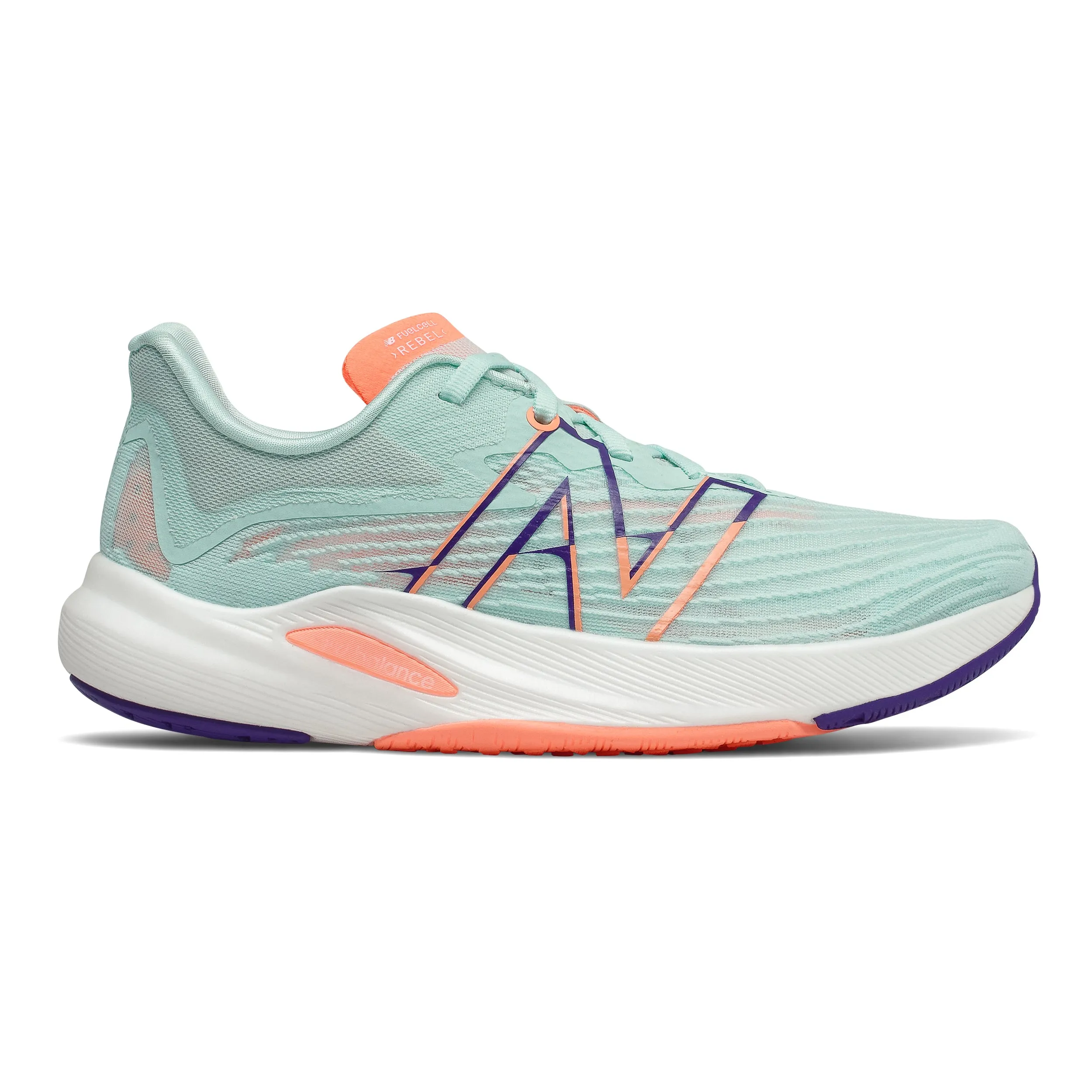 running in a dance studio shoes New Balance Fuel Cell Rebel V2