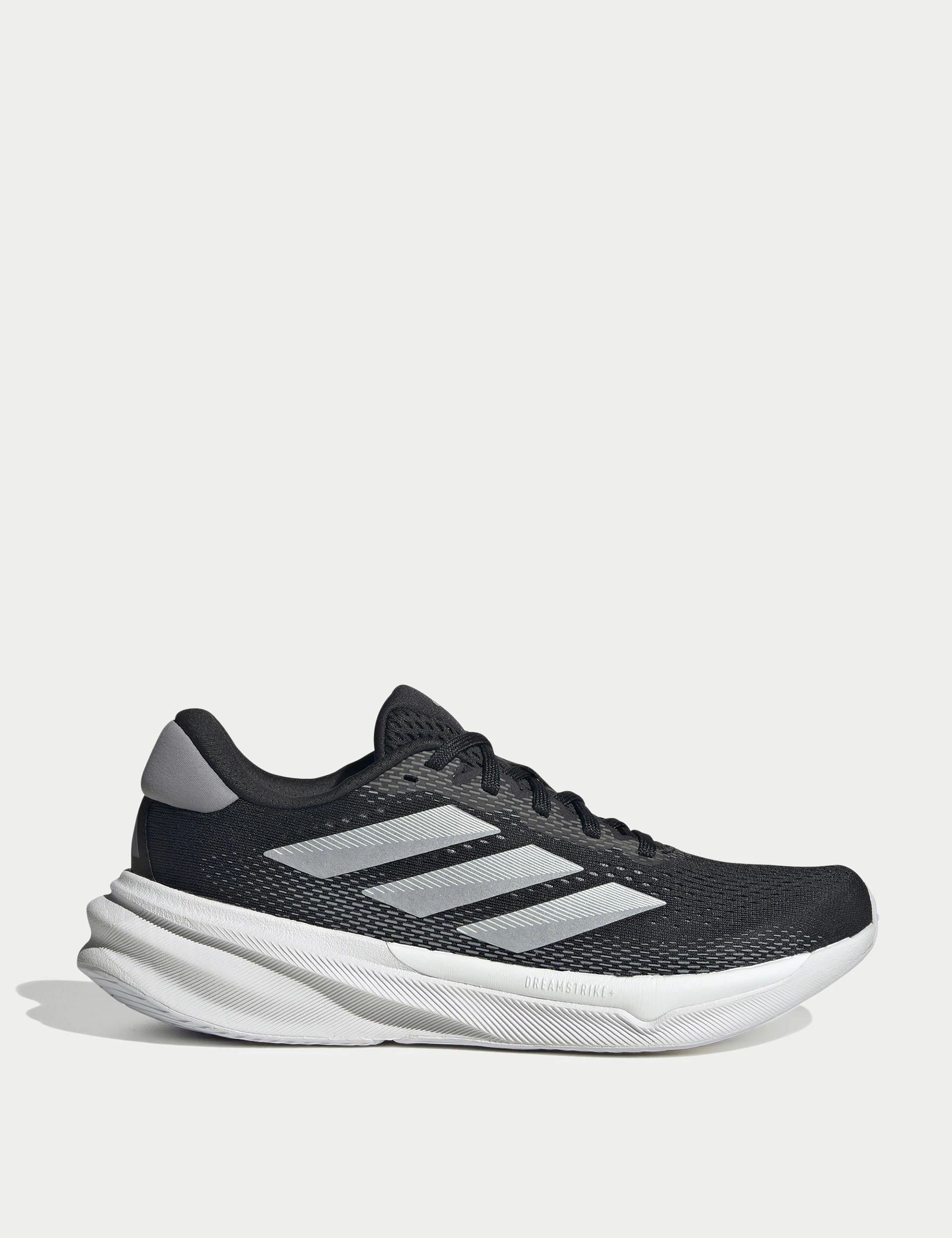 Supernova Stride 2.0 Running Shoes - Core Black/Cloud White/Grey Foam Bound Edges running in a meadow shoes
